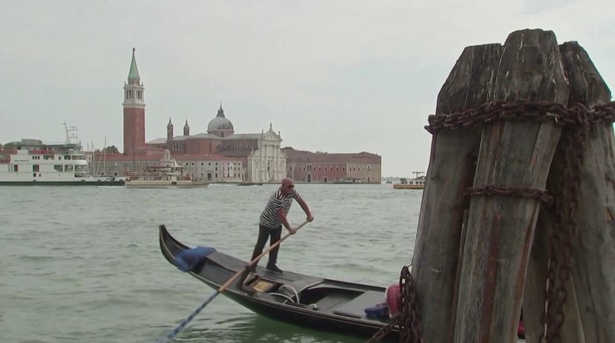 Tourists stroll the city of Venice amid travel surge
