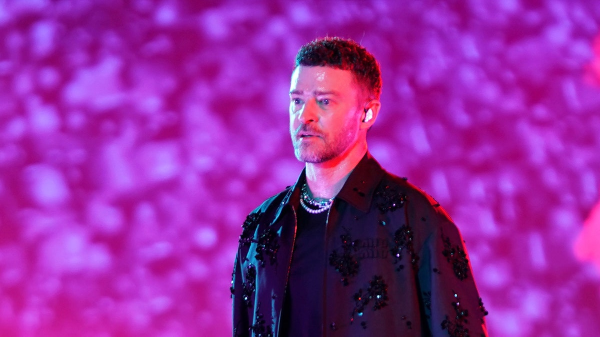 Justin Timberlake stands on stage