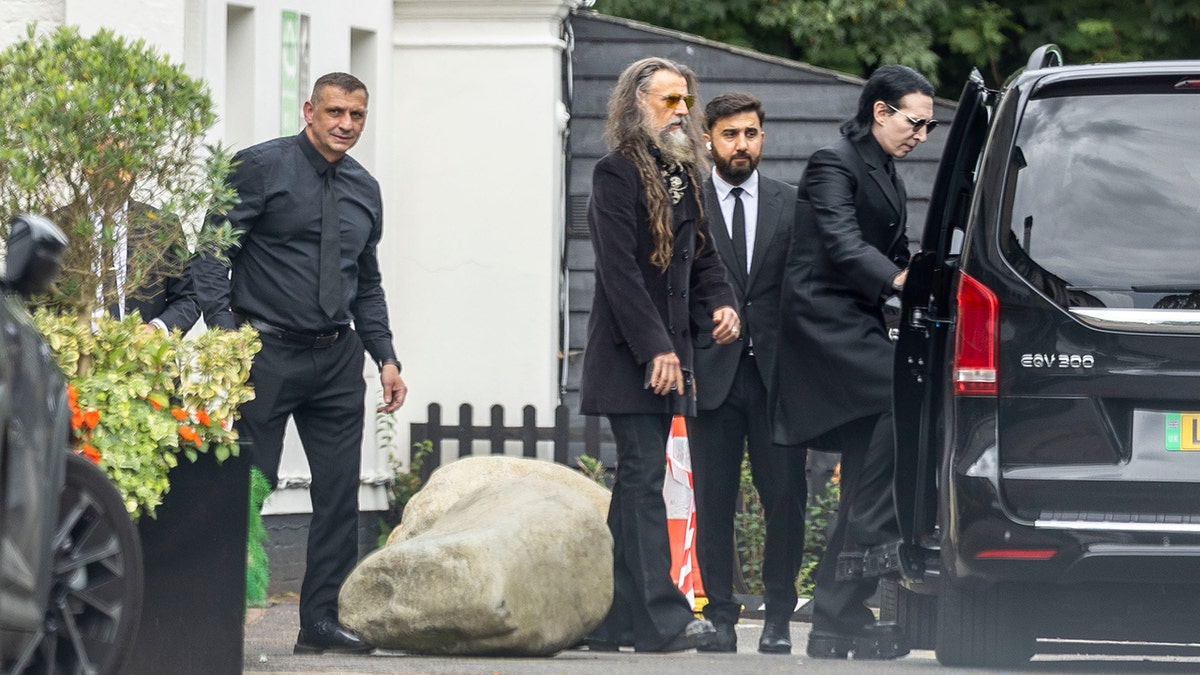 Rob Zombie and Marilyn Manson leave hotel to go to Ozzy Osbourne funeral