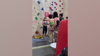 Risky stunt backfires as climber falls and gets rescued mid-drop by quick hero