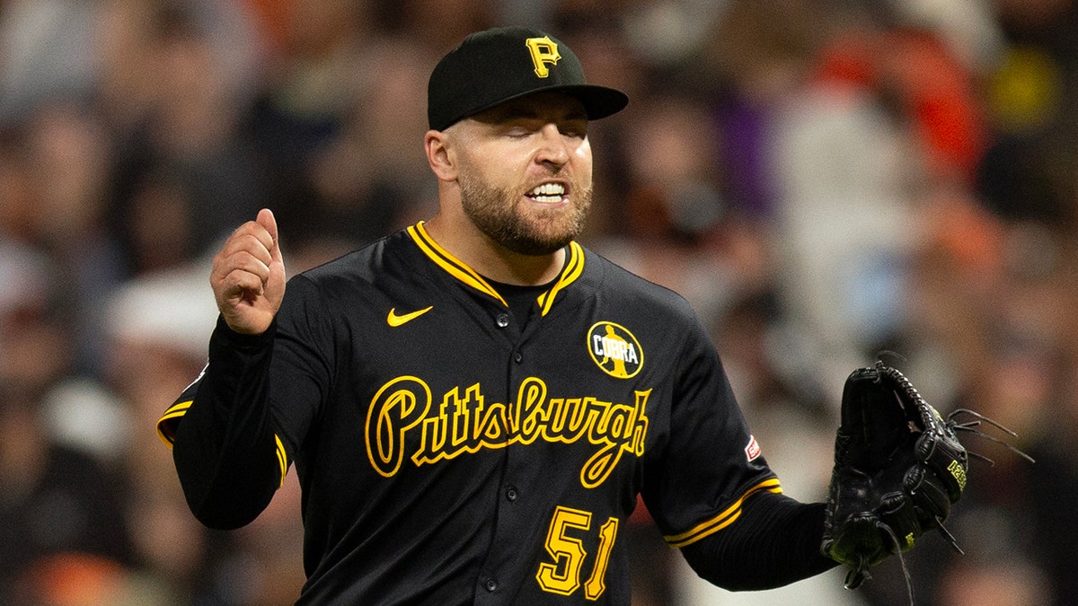 David Bednar reacts after pitching