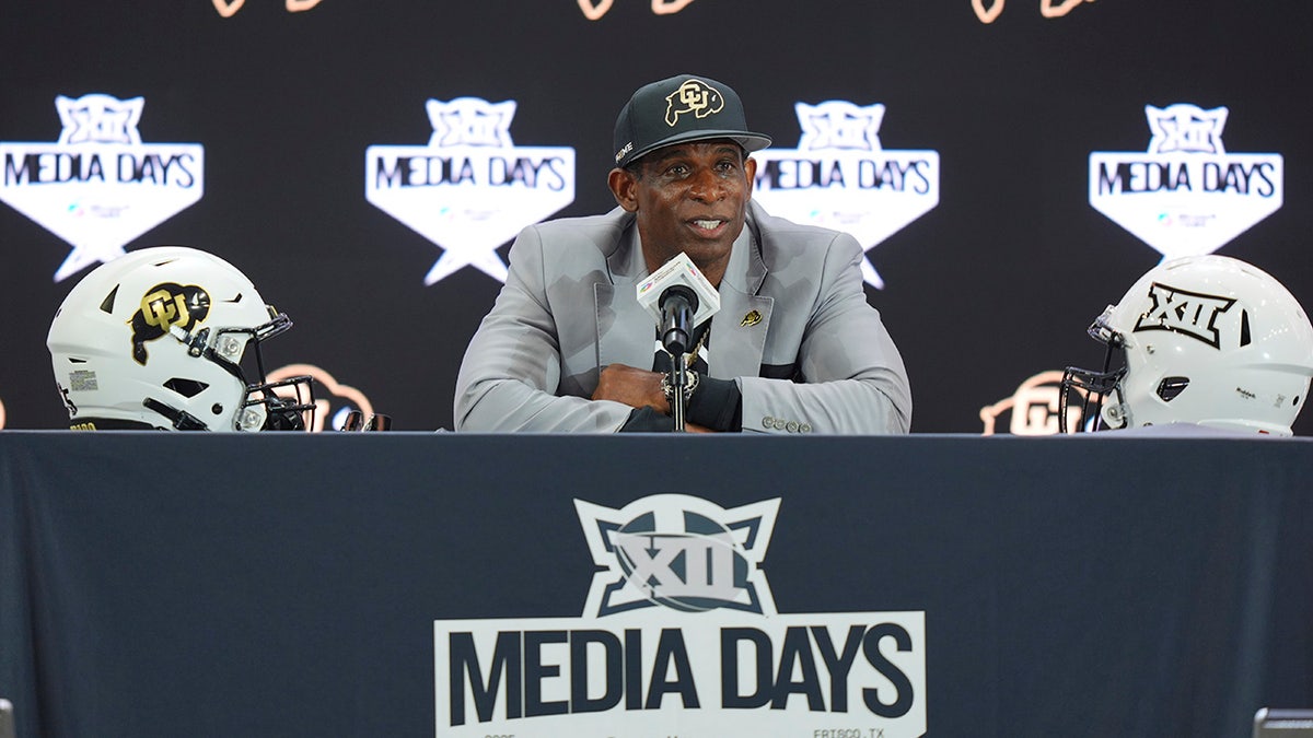 Deion Sanders at the podium