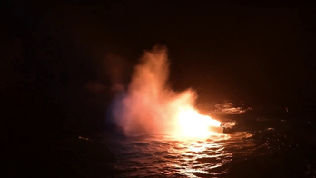 Coast Guard burns, sinks suspected 'drug boat,' apprehends 7 alleged drug smugglers: video